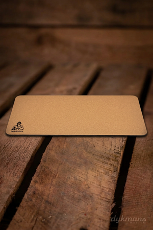 Dr. Liston's Supreme Guitar Mat op een warme houten achtergrond